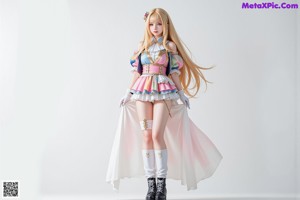A woman in a maid outfit posing for a picture.