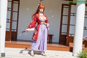 A woman in traditional attire stands on steps, holding a sword, with cherry blossoms in the background.