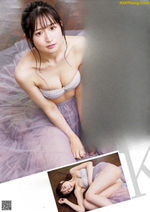 A woman in a white lingerie posing for a picture.