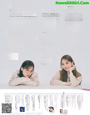 A couple of young women hugging each other in a magazine.